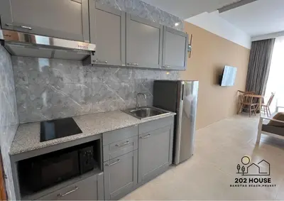 a kitchen with a sink and a refrigerator at 202 HOUSE near Bangtao Muay Thai & MMA in Ban Thalat Choeng Thale