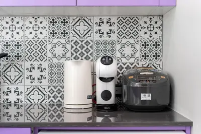 a kitchen counter with appliances on a tile wall at Brand New Design 2BR Villa Indra with Oxygen Pool in Rawai Beach