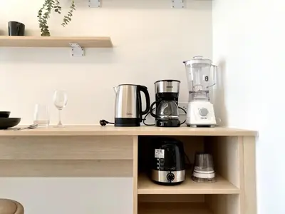 a kitchen with two appliances on a shelf at Fantasea Condo - Kamala in Kamala Beach