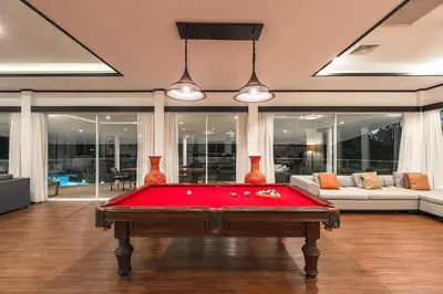 a room with a pool table in a house at V175 Huge 21M Pool 5-BR 1Km 2 Kamala Beach in Kamala Beach