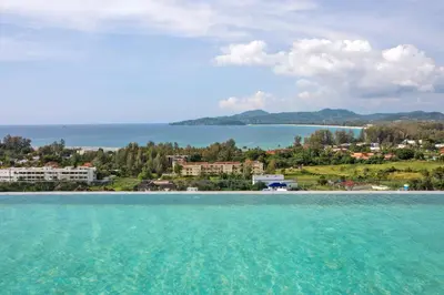a view from the water of a beach at 1bdr Seaview Apartment near Surin Beach in Surin Beach