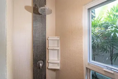 a bathroom with a shower with a window at Balinese Style 3BR Villa Morning Forest, Nai Harn in Rawai Beach