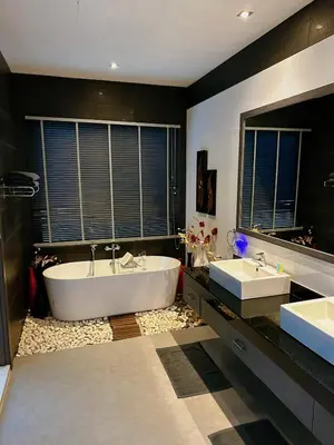 a large bathroom with two sinks and a tub at Luxury Pool Villa Nai Harn in Ban Saiyuan (1)