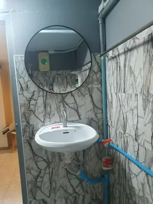 a bathroom with a sink and a mirror at Chill Apartment Lake View in Rawai Beach