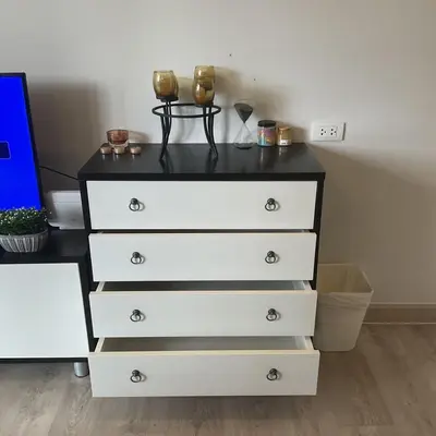 a dresser with two glasses on top of it at Royal Lee Phuket Condominium AirportB in Ban Bo Han