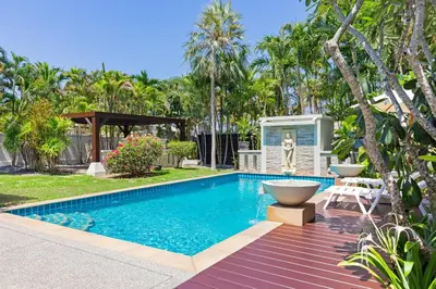 a swimming pool in a yard with a villa at 3BR Villa Barnabé with Lush Garden in Rawai Beach