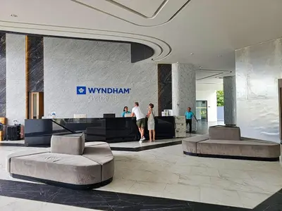 a lobby with people standing in a building at New Studio in 5 Hotel 500m to Rawai beach in Phuket Town