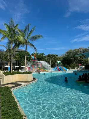 a pool at a water park with people in it at New Studio in 5 Hotel 500m to Rawai beach in Phuket Town