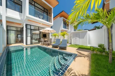 a swimming pool in the backyard of a house at Goldena Twin Project - 3 Bedrooms Pool Villa in Kamala Beach