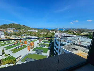 a view of a city from the balcony of a building at 2-Bedrooms Seaview Suite in Surin Beach in Surin Beach
