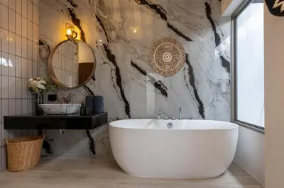 a bathroom with a large white tub and a sink at 3 Bedrooms Private Pool Villa near Laguna in Laguna Phuket