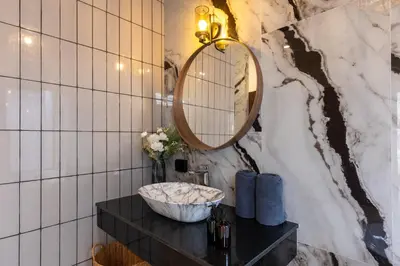 a bathroom with a sink and a mirror at 3 Bedrooms Private Pool Villa near Laguna in Laguna Phuket