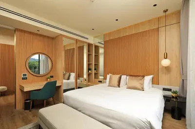 a bedroom with a large white bed and a desk at 2bdr Apartment with Bath near Bangtao Beach C512 in Laguna Phuket