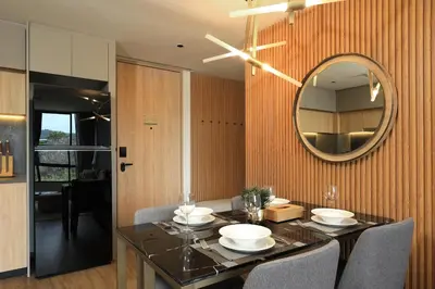 a dining room with a table and a mirror at 2bdr Apartment with Bath near Bangtao Beach C512 in Laguna Phuket