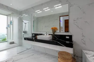 a bathroom with a sink and a mirror at Seaview three bedroom villa in Bangtao area in Ban Thalat Choeng Thale