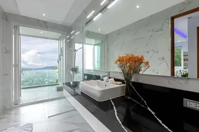 a bathroom with a sink and a large window at Seaview three bedroom villa in Bangtao area in Ban Thalat Choeng Thale