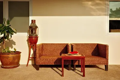 a living room with a couch and a table at Over the Moon villa in Patong Beach