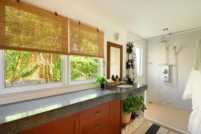 a bathroom with a sink and a large window at Over the Moon villa in Patong Beach
