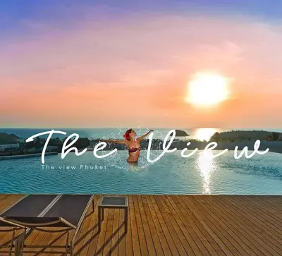 a woman in the water on a pier with the words the ocean at The View Phuket F9 in Kata Beach