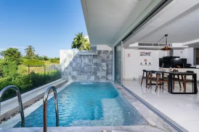a swimming pool in the middle of a house at The View Phuket F9 in Kata Beach