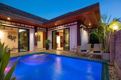 a swimming pool in the backyard of a house at Tropical 2BR Pool Villa 3D12 in Gated Residence Rawai VIP Villas in Rawai Beach