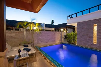 a swimming pool in the backyard of a house at Tropical 2BR Pool Villa 3D12 in Gated Residence Rawai VIP Villas in Rawai Beach