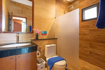 a bathroom with a toilet and a sink at Tropical 2BR Pool Villa 3D12 in Gated Residence Rawai VIP Villas in Rawai Beach