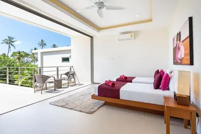 a bedroom with a bed and a balcony at Modern Thai-Balinese 2-Storey Pool Villa Kael in Ka Villas Residence, 500m from Famous Rawai Beach Seafood Market in Rawai Beach