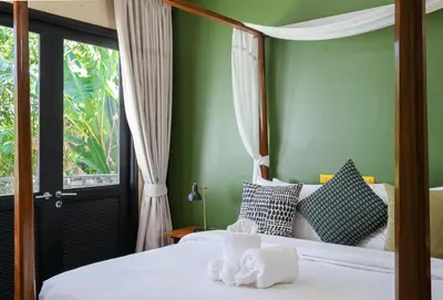 a bedroom with a bed with green walls and a window at Katamanda villa Eden Large Villa near Kata Beach in Kata Beach
