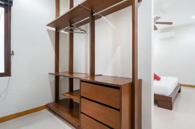 a room with a closet with wooden shelves at Pool Villa Martin 3BR, Rawai in Rawai Beach