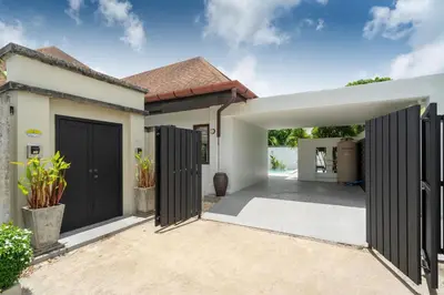 a home with black doors and a courtyard at Pool Villa Martin 3BR, Rawai in Rawai Beach