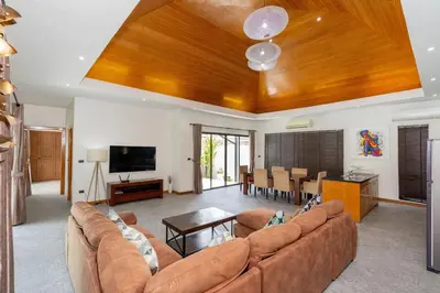 a living room with a couch and a table at Pool Villa Martin 3BR, Rawai in Rawai Beach