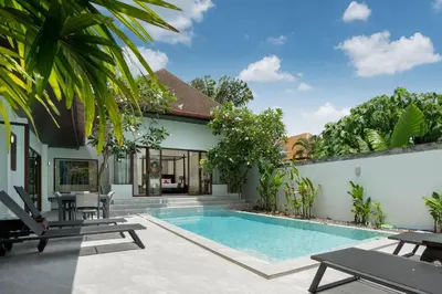 a swimming pool in the backyard of a villa at Pool Villa Martin 3BR, Rawai in Rawai Beach