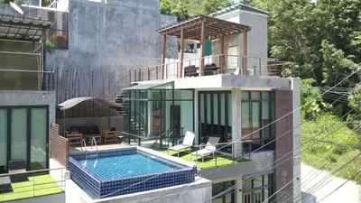 a house with a swimming pool on top of it at Villa Loma & Patong 6 chambres in Patong Beach