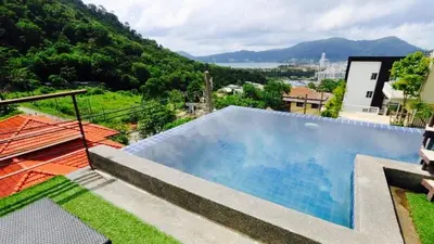 a large swimming pool on top of a house at Villa Loma & Patong 7 chambres in Patong Beach