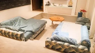 a living room with a couch and a table at 20 - Tranquil Retreat near Marriott Naiyang Beach in Nai Yang Beach