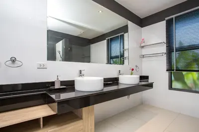 a bathroom with two sinks and a large mirror at Luxury 4BR Villa Virginie, Salt Pool, Rawai in Rawai Beach