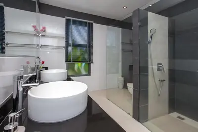 a bathroom with a white toilet and a shower at Luxury 4BR Villa Virginie, Salt Pool, Rawai in Rawai Beach