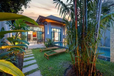 a house with a backyard with a pool at Villa Neya 2BR Private Pool Close to Naiharn Beach in Rawai Beach
