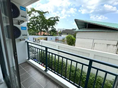 a balcony with a view of a building at New 2br apartment -stylish Fantasea Kamala Condo in Kamala Beach
