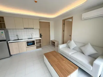 a living room with a white couch and a kitchen at New 2br apartment -stylish Fantasea Kamala Condo in Kamala Beach