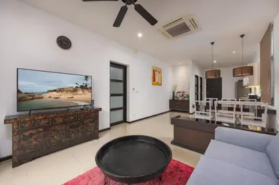 a living room with a large flat screen tv at VILLA Hanga 3BR Private Pool Nai Harn Beach in Nai Harn Beach