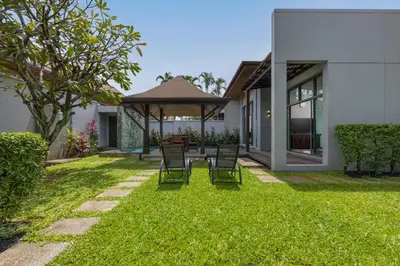 a backyard with chairs and a gazebo at VILLA Hanga 3BR Private Pool Nai Harn Beach in Nai Harn Beach