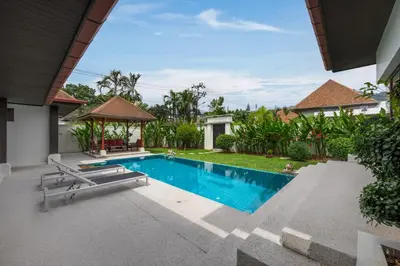 a swimming pool in the backyard of a house at Villa Iorangi 3 Bedroom Private Pool in Rawai Beach