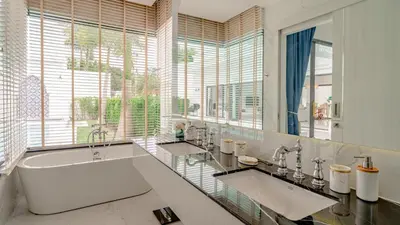 a bathroom with two sinks and a large tub at Bang Tao Luxury Villa - Menara Hill in Ban Phak Chit
