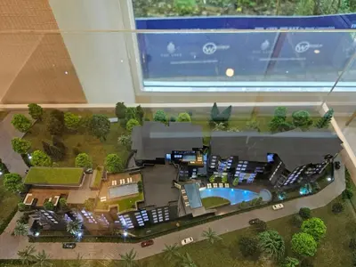a model of a house with a pool and a window at The City Condo Near Central Fest Phuket, Pool view in Ban Sam Kong