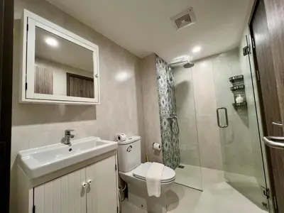 a bathroom with a toilet and a sink and a shower at The Title NaiyangPhuket1 in Phuket