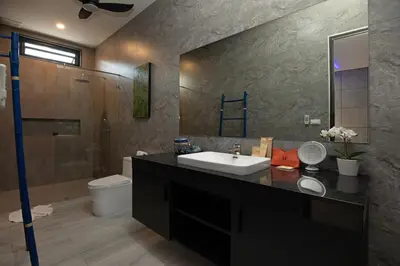 a bathroom with a sink and a shower and a toilet at Stunning 4 bedrooms pool villa at Rawai kokmakham 2 in Rawai Beach
