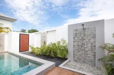 a house with a swimming pool in the yard at Two-Bedroom Villa with Salt Pool in Rawai villa hapai in Rawai Beach