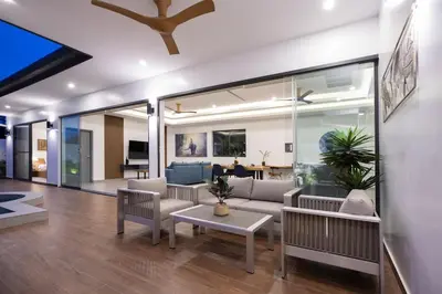 a living room with a couch and a table at Two-Bedroom Villa with Salt Pool in Rawai villa hapai in Rawai Beach